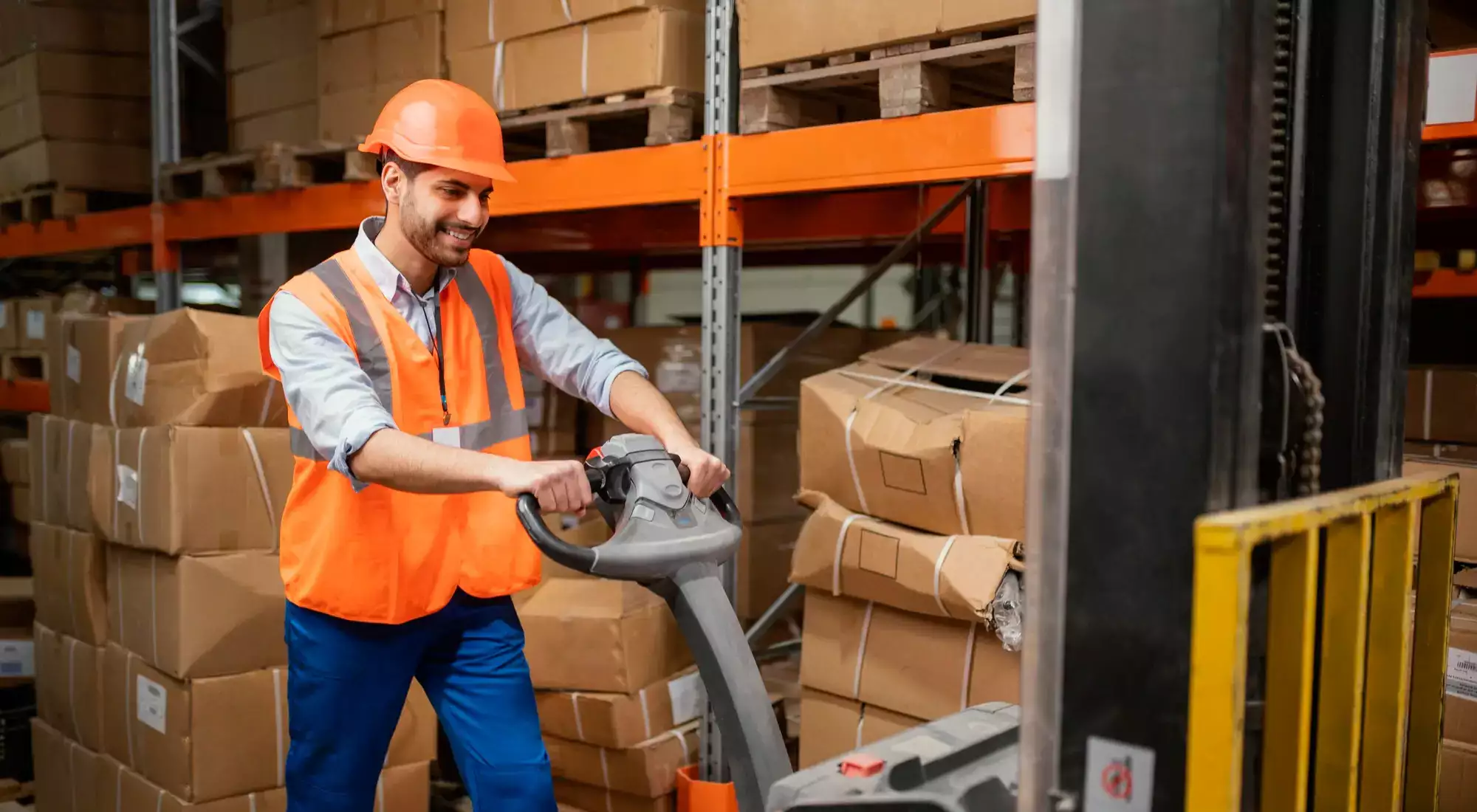 A Warehouse Worker operating Electric Pallet Jack